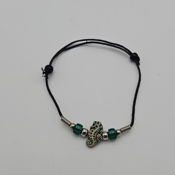 Jewelry - black slider bracelet with green and cream seahorse bead